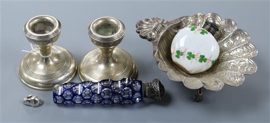 A quantity of silver including dwarf candlesticks, butter shell, two mounted scent bottles and a miniature rabbit.